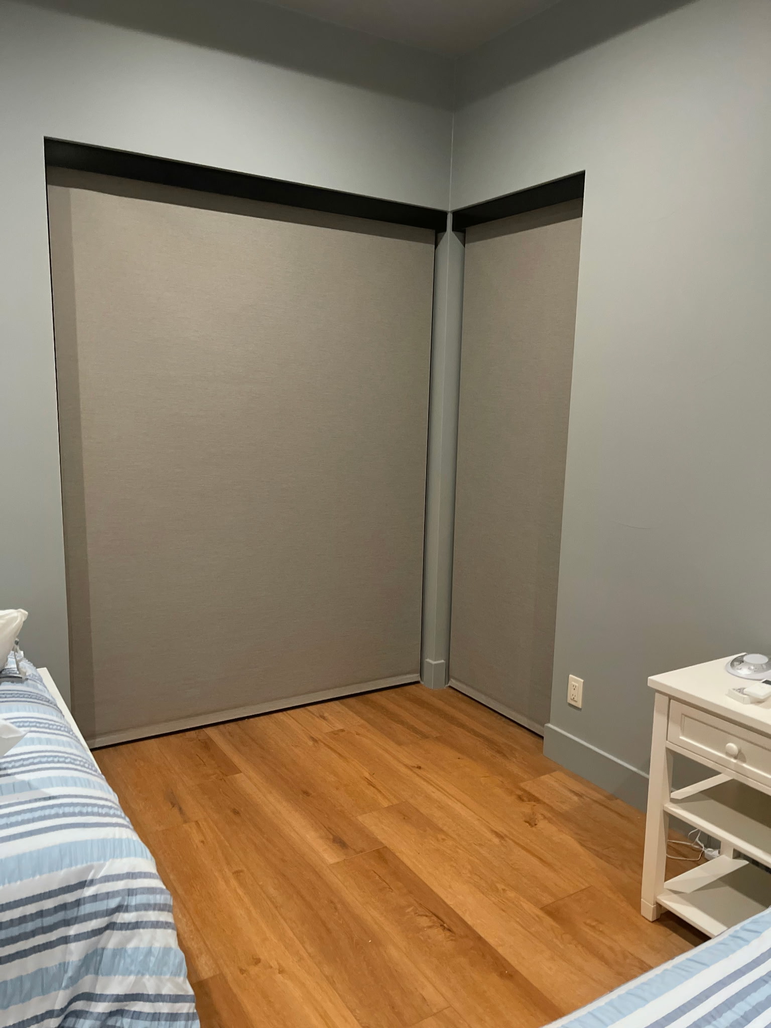 Blackout Roller Shades: Corner Bedroom | Beacon Blinds